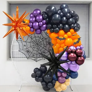 Halloween balloon arch setup detail featuring black, purple and orange latex balloons with spider.