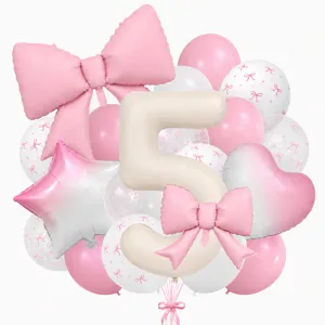 Detail view of the cream number 5 balloon with pink bow and assorted party balloons set.