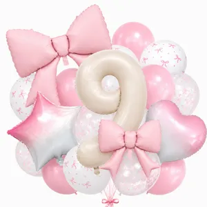 Close-up detail of cream bow number 9 balloon set, pastel pink party decoration backdrop.