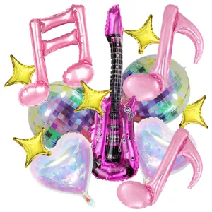 Detailed view of rock guitar and music note foil balloons set for disco party decoration.