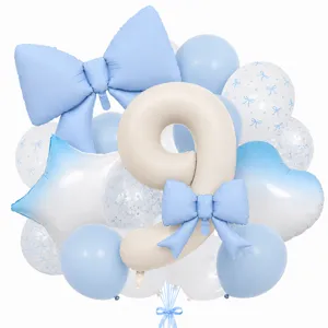 Detail shot of cream number 9 balloon with blue bow and star heart foil balloon party decor