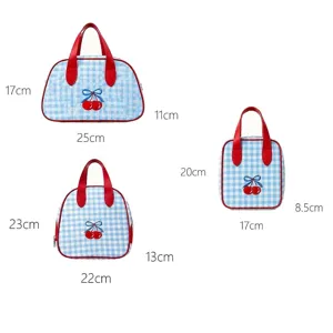 Detailed size chart showing dimensions for blue gingham cosmetic bags with cherry embroidery.
