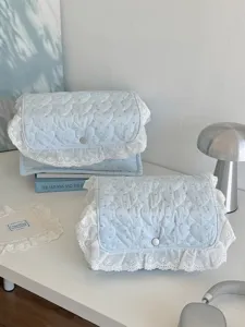 Light blue quilted storage basket with white lace trim, cute desktop organizer box for dorm.