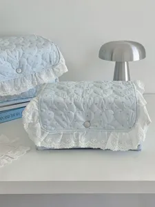 Light blue quilted storage box with lace ruffle, cute desktop organizer for dorm bedroom decor.