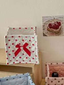 Quilted storage basket fabric detail with red polka dots and cute bow decoration