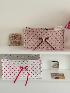 Quilted rectangular desktop storage box with cute heart polka dots and ribbon bow detail.