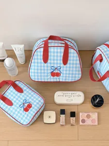 Blue plaid cherry cosmetic bag, large capacity travel portable handheld storage detail view.