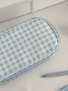 Blue and white plaid pencil case close-up, showing neat zipper and fabric texture detail.