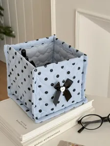 Quilted square storage basket with polka dots, bow design, perfect for desk and dorm organization.