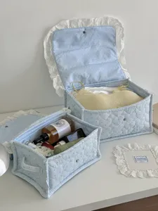 Light blue quilted storage basket with lace trim, cute star pattern desktop organizer box.