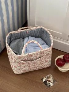 French quilted storage basket with vintage floral print, portable fabric laundry bin.