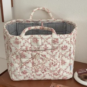 French vintage toile de jouy quilted storage basket with dual handles and inner gingham lining.