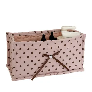 Pink polka dot fabric storage box with bow, desktop organizer basket for cosmetics and sundries.