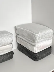 Grid travel packing cubes set, lightweight organizer bags for luggage suitcase storage and sorting.