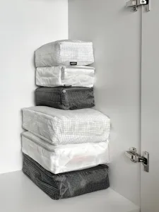 Grid travel storage bags set, thin zipper packing cubes for suitcase organization.