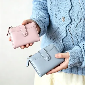 Detail shot of women macaron color folding wallet with card slots and zipper pocket.