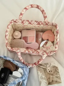 Quilted bow fabric storage basket, cute desktop cosmetic and sundry organizer container.