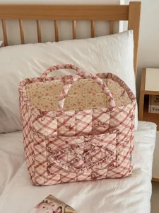 Gesteppter Schleifen-Aufbewahrungskorb mit Blumenfutter, tragbarer Stoff-Organizer für Zuhause.