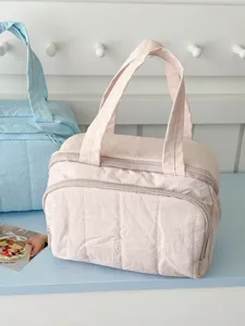 Soft quilted nylon cosmetic bag in pastel pink, spacious daily storage pouch for toiletries.