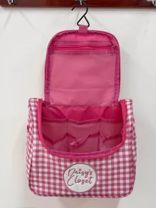 Roze en witte gingham cosmetische tas grote capaciteit hangende toilettas voor reis.