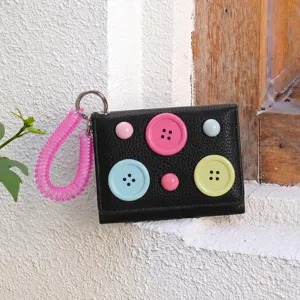 Korean dopamine trifold coin purse with colorful buttons and pink spring strap detail.