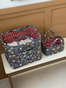 Gesteppter Aufbewahrungskorb aus Stoff mit Blumenmuster, langlebig und ideal für Organisation.