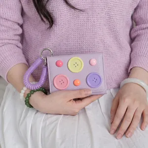 Korean style dopamine color trifold mini wallet with spring rope and cute button decorations.