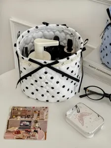 Quilted polka dot cylindrical storage basket with bows and lace. Perfect desktop organizer bin.
