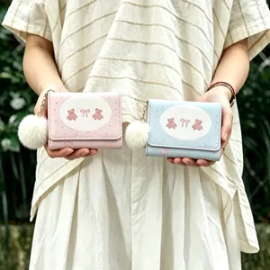 Cute cartoon bear trifold short wallet with fluffy pom-pom charm for women daily use.