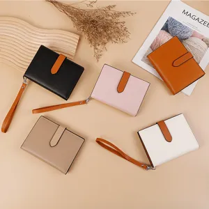 Stylish colorblock women wallet and passport holder with wrist strap, multi-functional design.