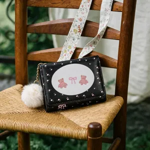 Cute cartoon wallet short tri-fold card holder with fluffy ball pendant and floral strap detail.