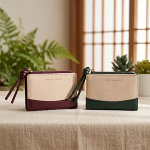 Canvas leather short wallet with zipper, wrist strap and contrast color design for women.