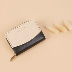 Detail view of the stylish bi-color mini wallet showing gold zipper and card compartments.