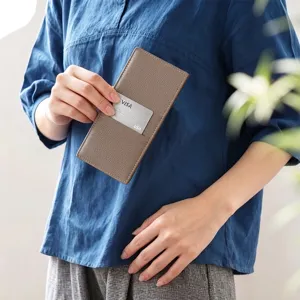 Slim minimalist brown long leather card wallet detail view, elegant portable carry accessory.
