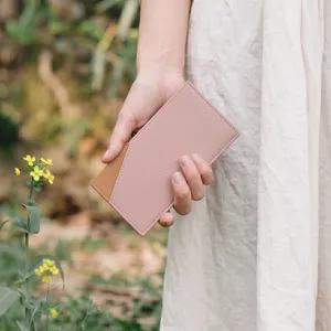 Detailed view of the minimalist slim leather card holder in pink and brown, perfect for daily use.