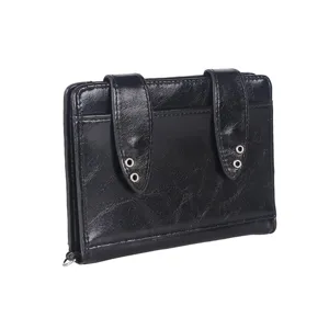 Black shiny leather passport holder detail, cute rabbit ears design with metal eyelets.