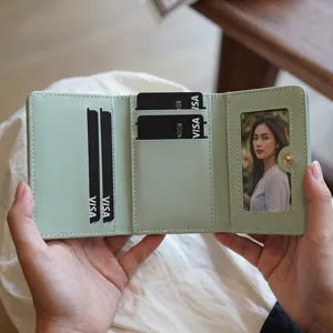 Minimalist mint green trifold women wallet with multiple card slots and photo window.