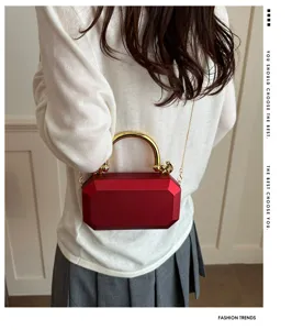 Stylish red acrylic box bag with gold metal handle and chain strap for women evening party.