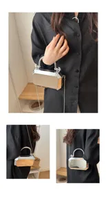 Detail shot of a silver metallic acrylic box bag with chain strap and elegant evening handle.