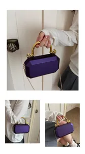 Purple acrylic box evening clutch bag with gold handle and chain strap, detailed view for women.