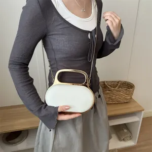 Elegant white acrylic evening bag with metal handle and chain strap for women fashion.