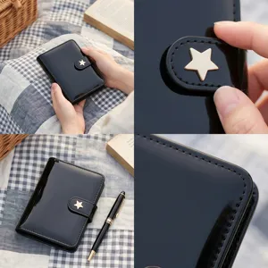 Vue detaillee du carnet agenda en cuir vernis noir avec fermoir etoile dobee elegant.