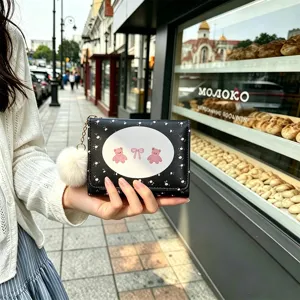 Cute trifold women's wallet with cute pink bear pattern, compact size with fluffy pom pom charm.