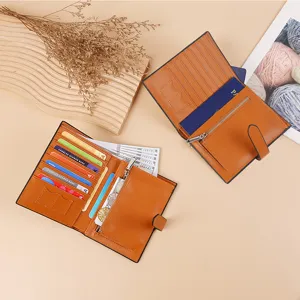 Multifunctional brown PU leather passport holder wallet with card slots and zipper pocket.