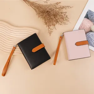 Detail view of the contrast color passport holder, elegant multi-functional wallet for women.