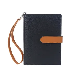 Stylish color-block passport holder with wrist strap, multi-functional travel document wallet.