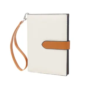 Detailed view of the chic two-tone passport wallet, multi-functional design for women.