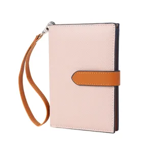 Color-block passport holder wallet with wrist strap, multi-functional travel organizer for women.