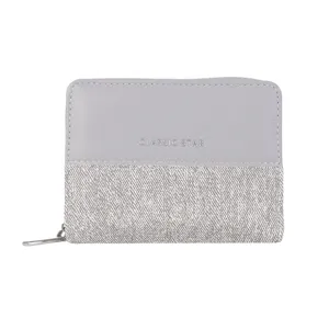 Close-up detail of the grey two-fold short women wallet featuring denim patchwork design.