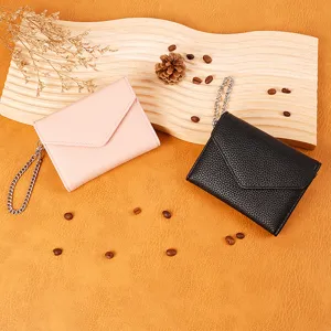 Minimalist lychee pattern short wallet with chain, compact daily use coin purse detail view.